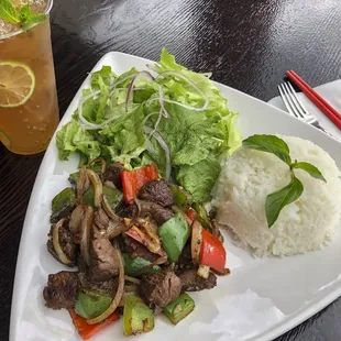 Monarch Shaken Beef, cubed filet mignon carmalized with white onions, and bell peppers. Served with jasmine rice and side salad