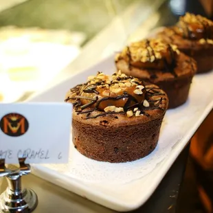 "Chocolate Caramel Crunch" (gluten free) flourless chocolate cake topped with caramel and crunchy almonds, hazelnuts and chocolate.
