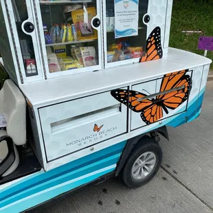 a cart with a butterfly painted on it