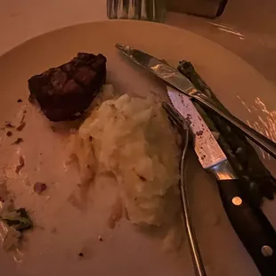 What&apos;s left over of a unseasoned 4oz filet, mashed potatoes and asparagus.