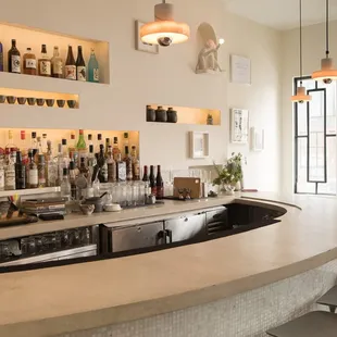 a bar with bottles of alcohol