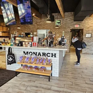 a woman standing in front of the counter