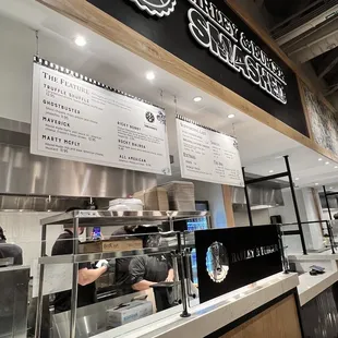 the counter and menus of the restaurant