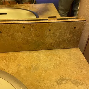 "Private bathroom" in their photo looks like marble. But it is formica and held in place with nails