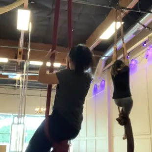 There are four silks with crash pads in the back of the room.