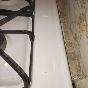 Soiled stove top area with grime