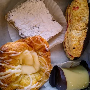 Clockwise from top: lemon bar, French waffle, marzipan truffle, cheese danish