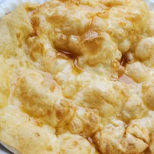 a person holding a tray of food