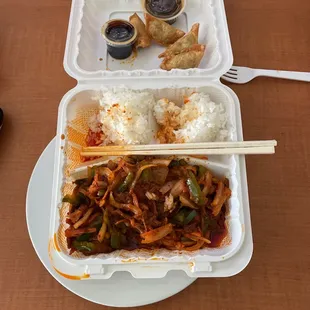 a meal in a styrofoam container