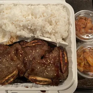 Galbi with perfectly cooked white rice and two sides of kimchi.