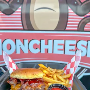 a cheeseburger with fries and ketchup