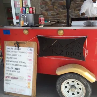  a man selling food from a cart