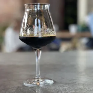 a glass of beer on a table