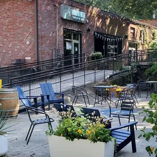 a patio with tables and chairs