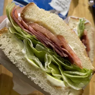 a sandwich with lettuce and ham