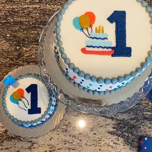 a birthday cake and cupcakes