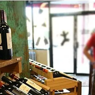 a man and a woman in a wine shop