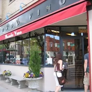 a woman walking in front of a restaurant