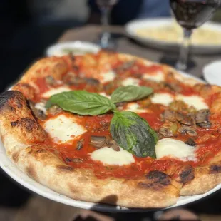 Amazing Margherita pizza. Added mushrooms and olives. The crust was perfect, light and crunchy on the edges.