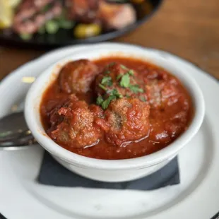 Polpette - baked, lightly breaded meatballs, spicy tomato sauce dip, served with bread