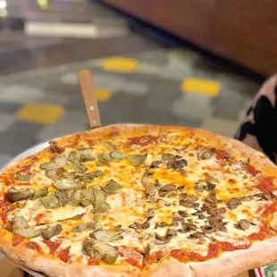 a pizza with mushrooms and cheese