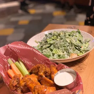 chicken wings and salad
