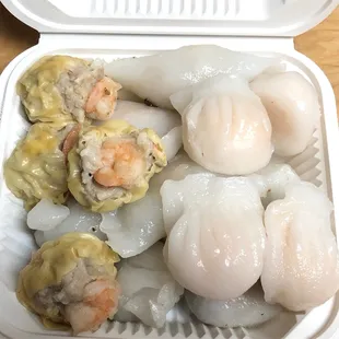shrimp, shrimp, and shrimp dumplings in a styrofoam container