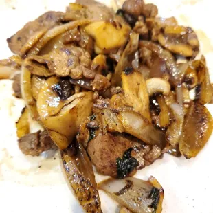 a plate of mushrooms and onions