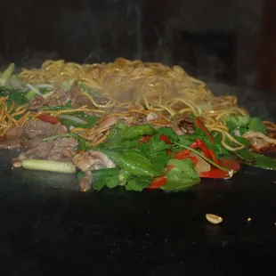Unique buffet style, Asian stir-fry meal that is cooked right in front of your eyes on a traditional large, open griddle.