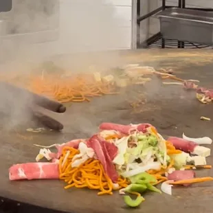 Cook  in front of you