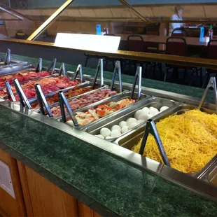 a variety of food items in a buffet