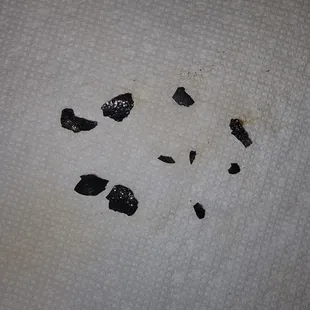 Black chunks from cook top
