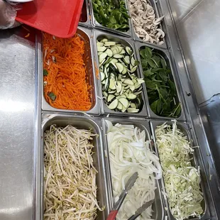 a variety of vegetables being prepared