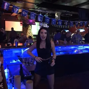 a woman sitting at a bar