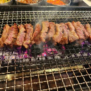 a grill with meat on it