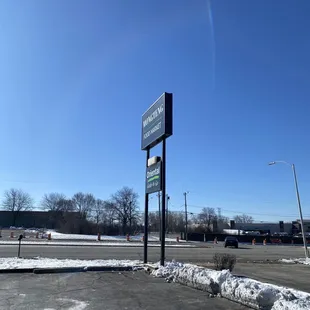 a parking lot with snow on the ground