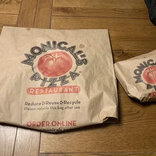 Old school pizza in a bag, although they cover the pizza in aluminum foil and deploy the plastic pizza risers.