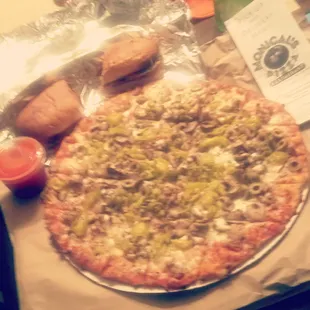 A hot Sicilian sandwich with and Italian supreme pizza. Oh and can&apos;t forget the special Monical&apos;s dipping sauce for the pizza!