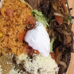 This is the chilaquiles with Spanish Steak. It comes with eggs but they came on the side this time. Best chilaquiles around!