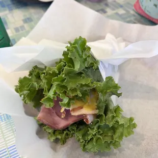 Lettuce wrapped turkey and ham sandwich