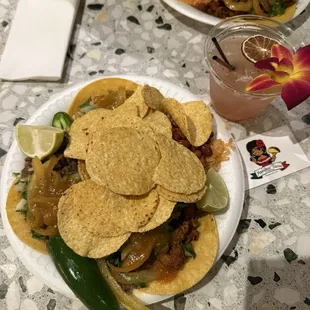 Chefs plate. Steak, chicken and pork tacos with onions, salsa, grilled onions, jalapeño and lime.