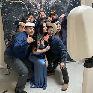 Guests having fun taking pics at the photobooth