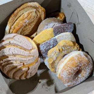 a variety of pastries in a box