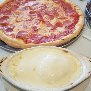 Baked ravioli in Alfredo sauce and our pizza!