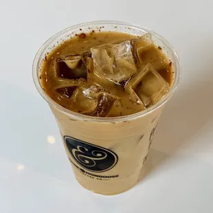 a cold drink in a plastic cup