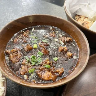 a bowl of stew and a bowl of rice