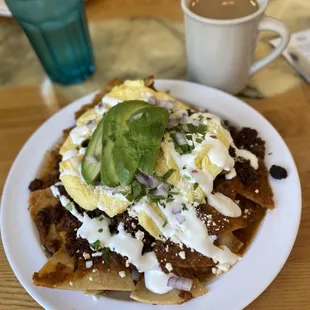 Chilaquiles with spicy red sauce &amp; chorizo