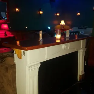 a fireplace with candles on it