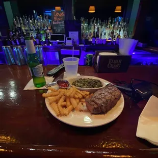a plate of steak and french fries