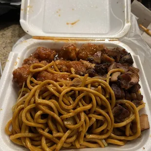 noodles and meat in a styrofoam container